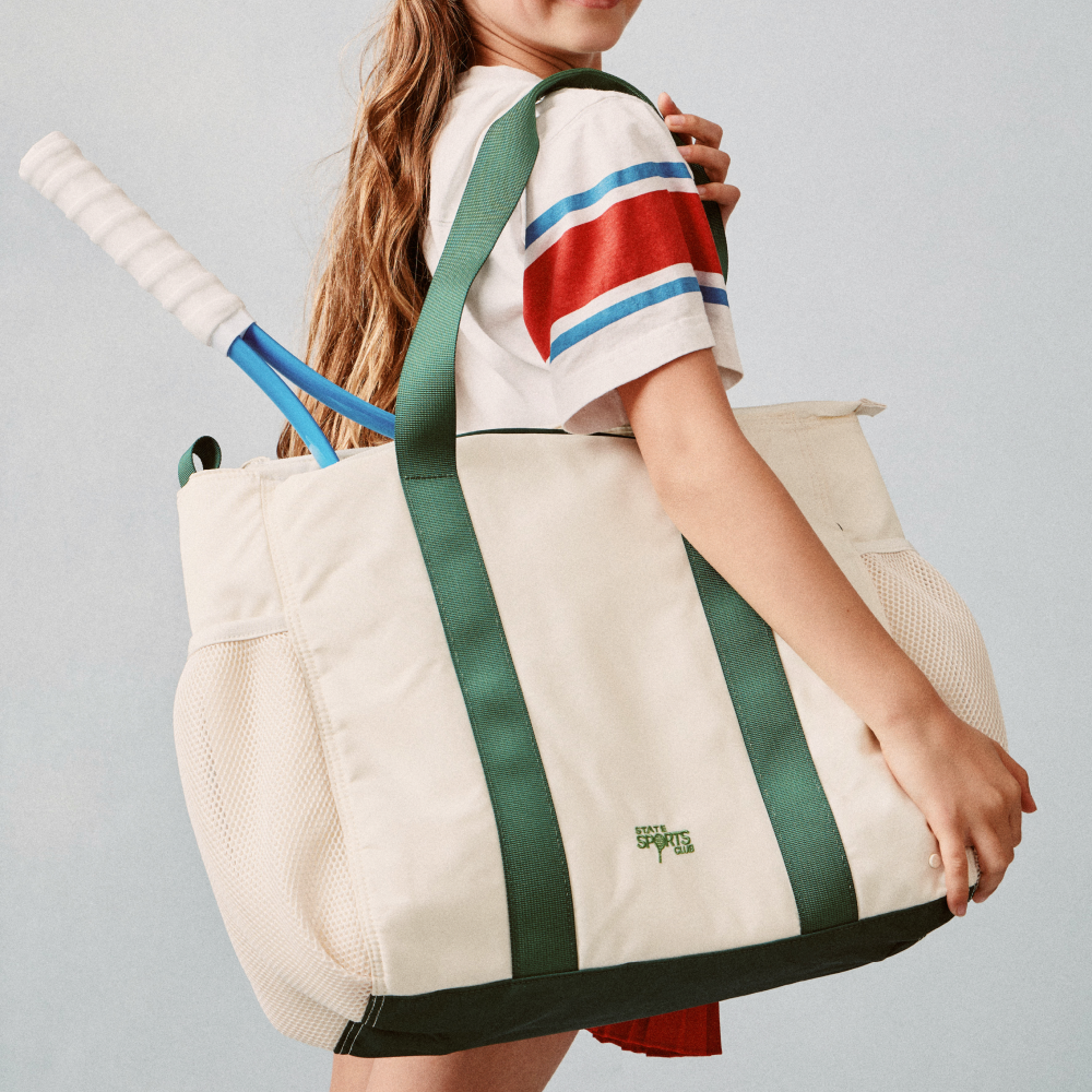 Girl holding STATE Bags Riley Tennis Bag Pristine Click to Zoom
