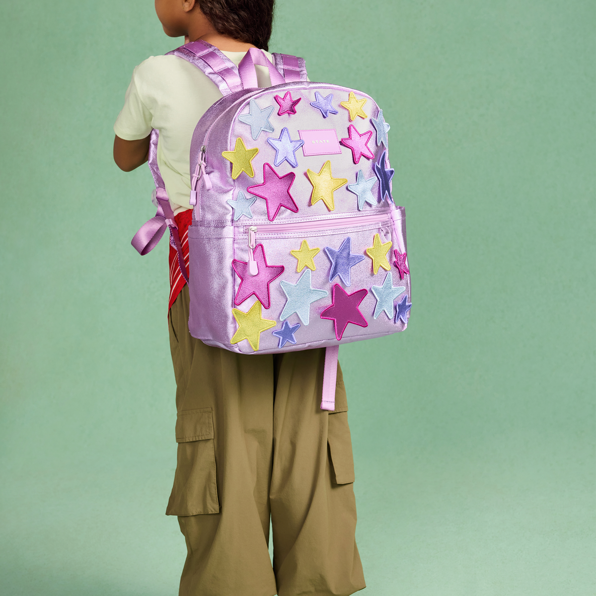 girl wearing state bags 3d stars backpack
