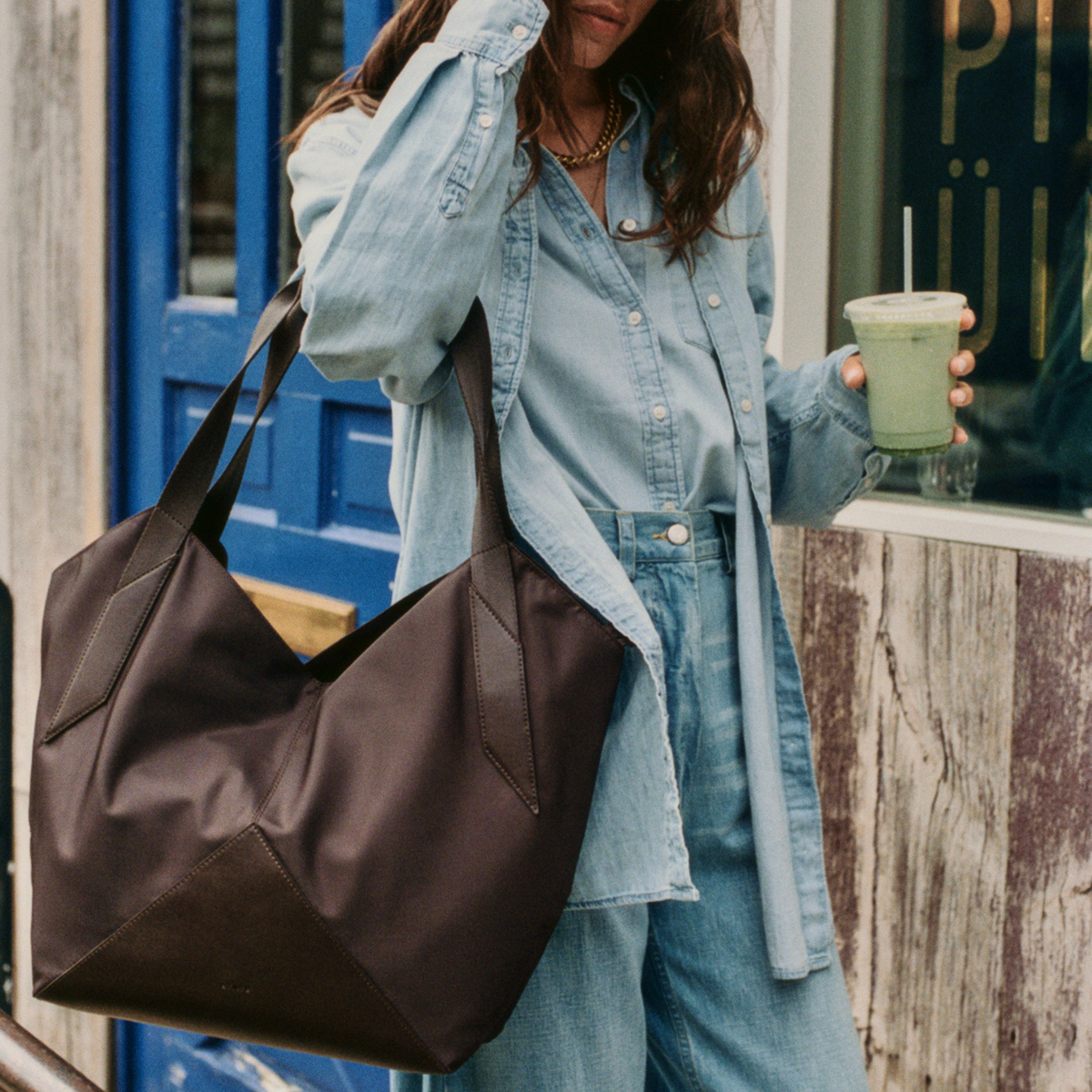 woman holding matcha and STATE Bags Beverly Tote Brown 