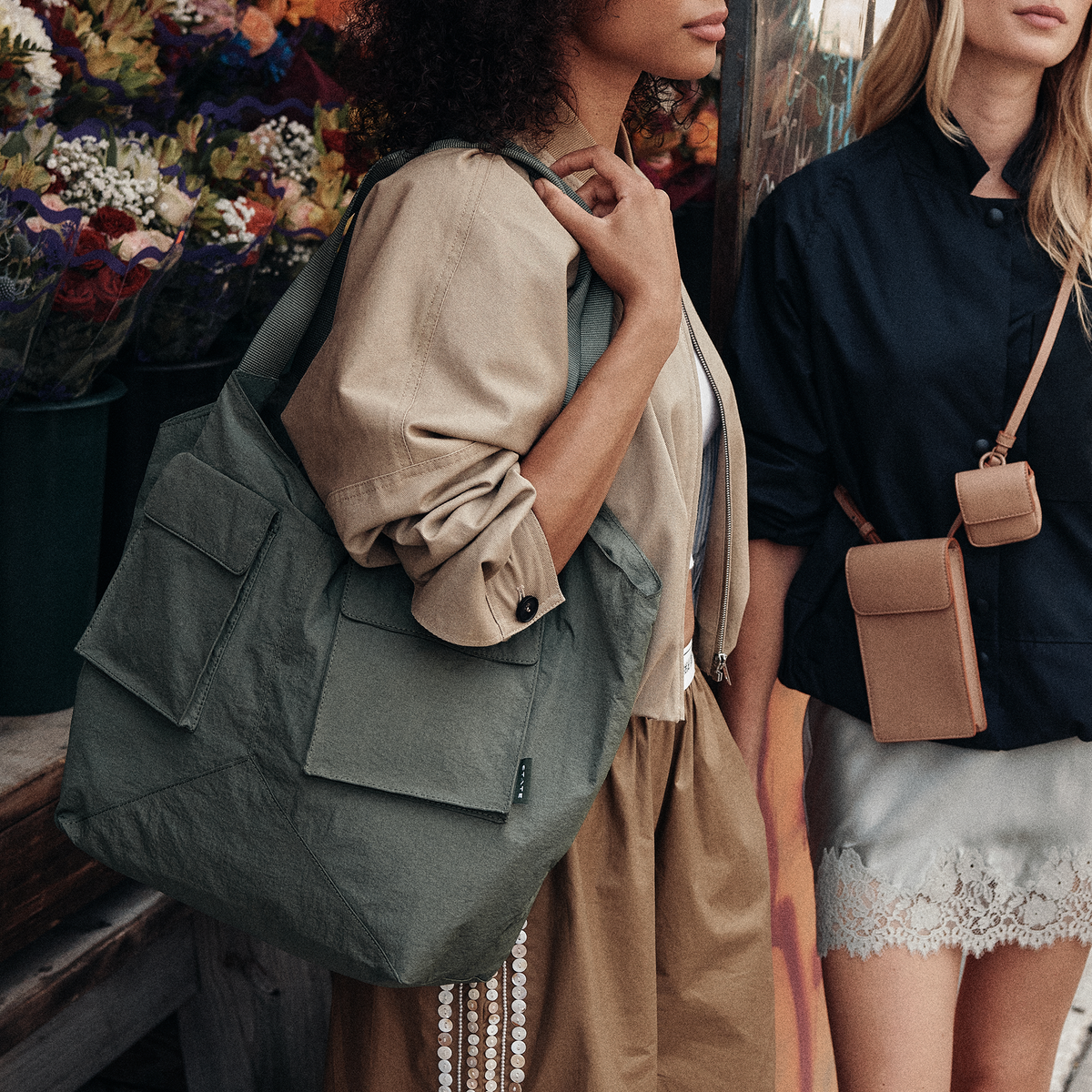 Image showing woman wearing STATE Bags Beverly Tote Crinkled Nylon Olive