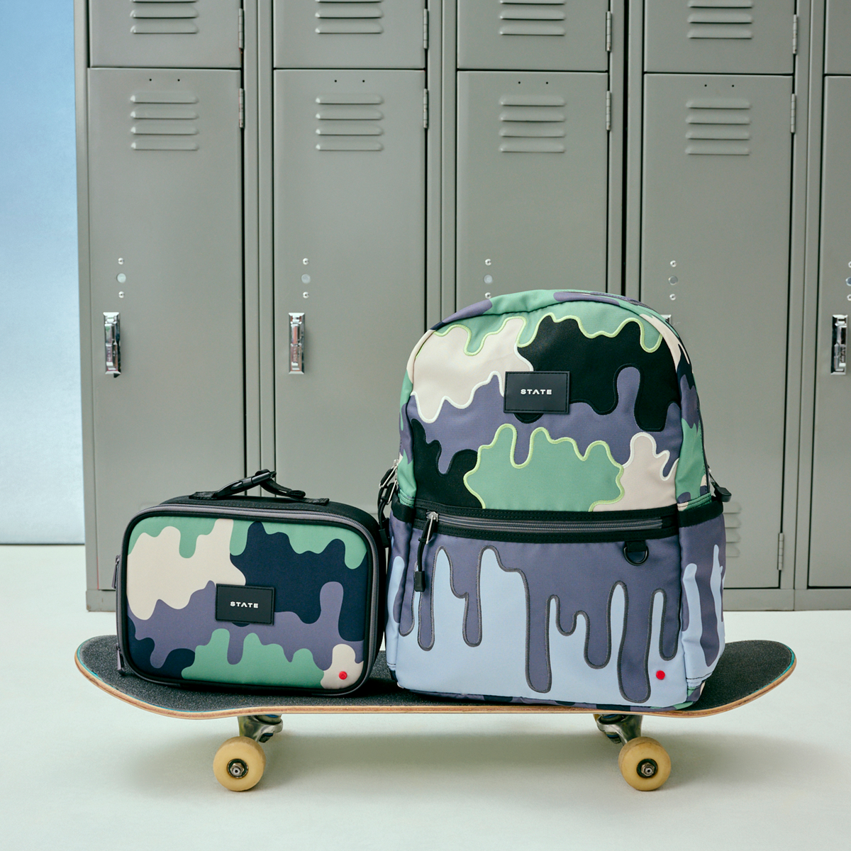 STATE Bags Kane Backpack Camo Drip on skateboard