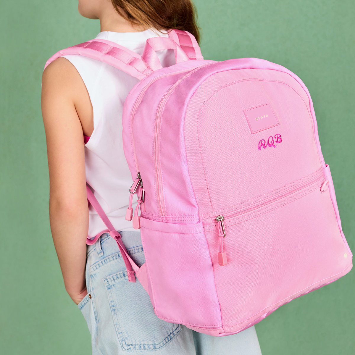 girl wearing STATE Bags kane double pocket pink
