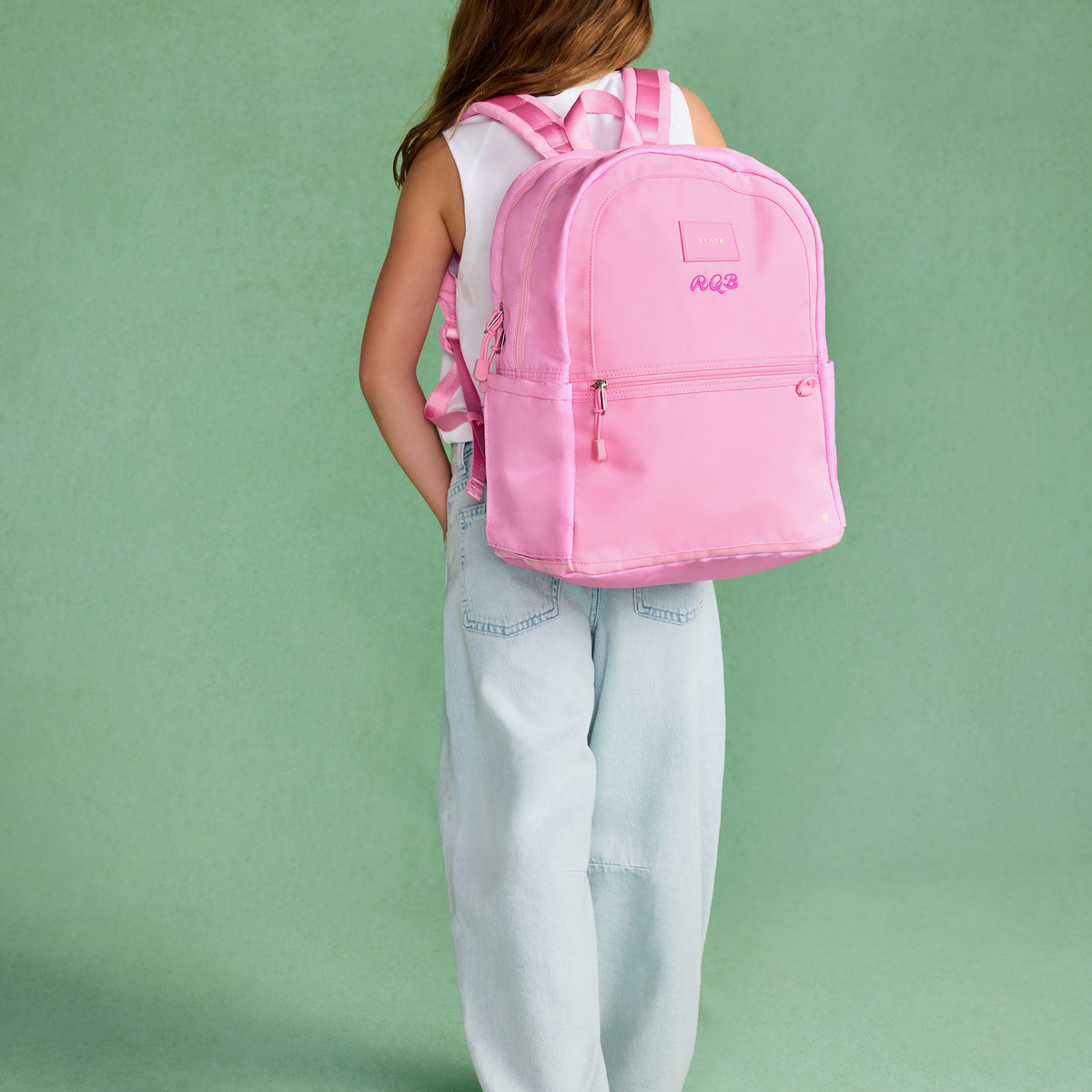 girl wearing STATE Bags Kane Double Pocket Large Pink