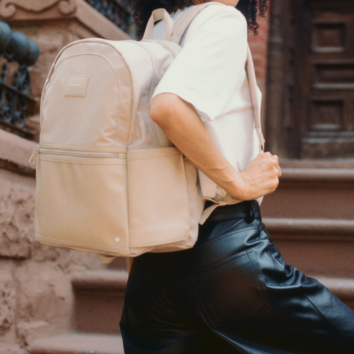 woman holding state bags evans double pocket sand