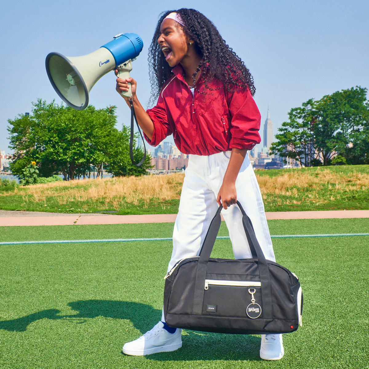 girl holding STATE Fenway Sports Duffle Black 