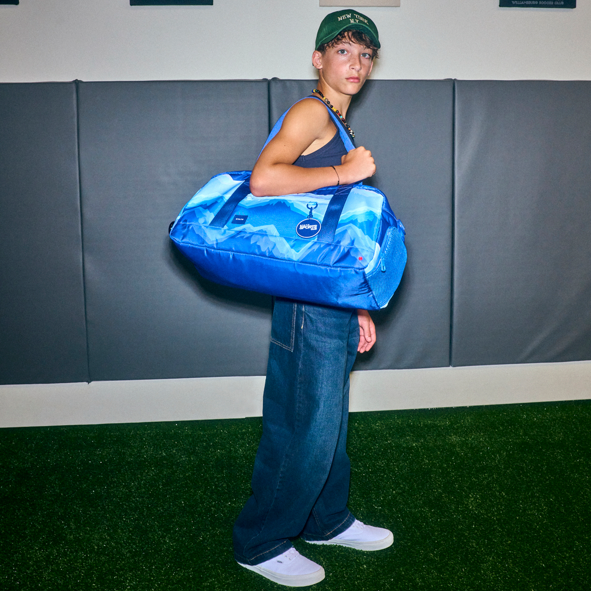 boy wearing STATE Bags Fenway Sports Duffle Mountains
