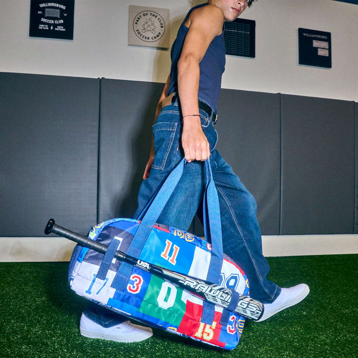 boy holding STATE Fenway Sports Duffle Varsity Numbers