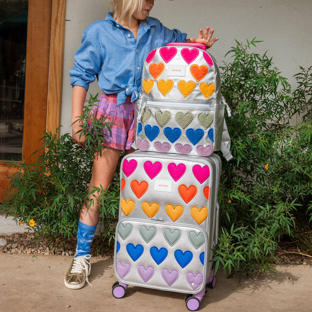 girl with kane and logan fuzzy hearts outside