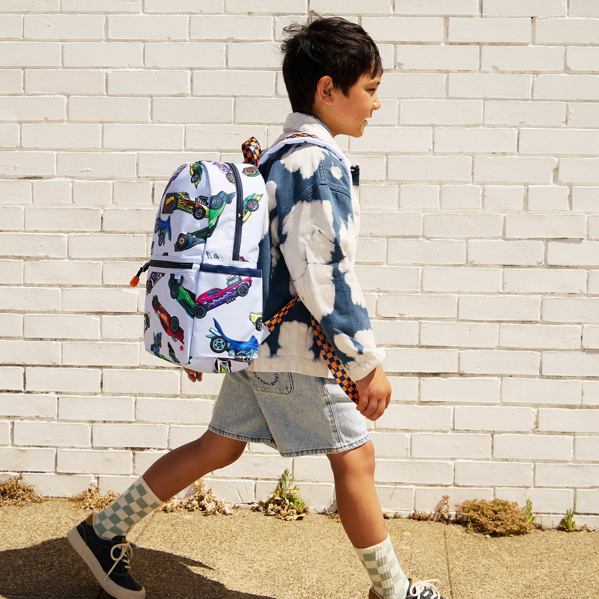 Boy wearing STATE x Hot Wheels Kane Backpack Hot Wheels Cars 
