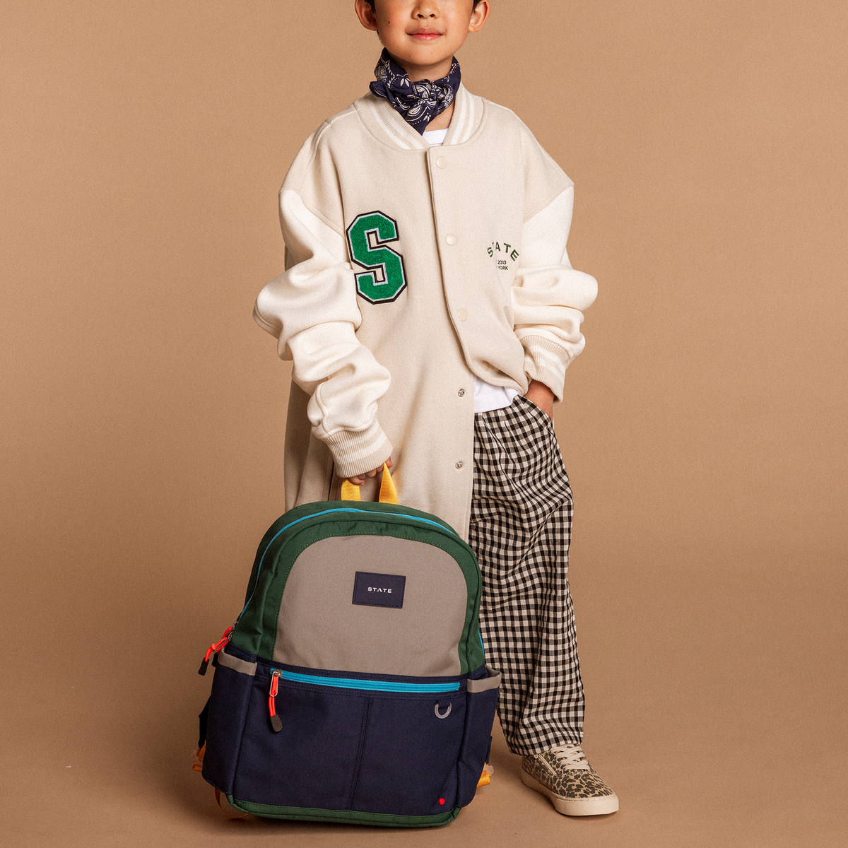 Boy standing holding Kane Backpack Green/Navy