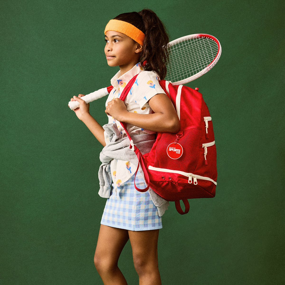 girl wearing STATE Bags Lenox Tennis Bag Red 