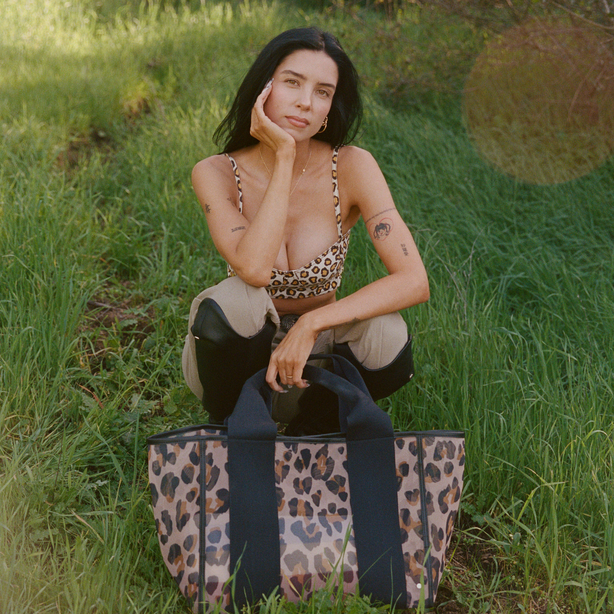 Woman wearing STATE Bags Wellington Cabana Tote Leopard