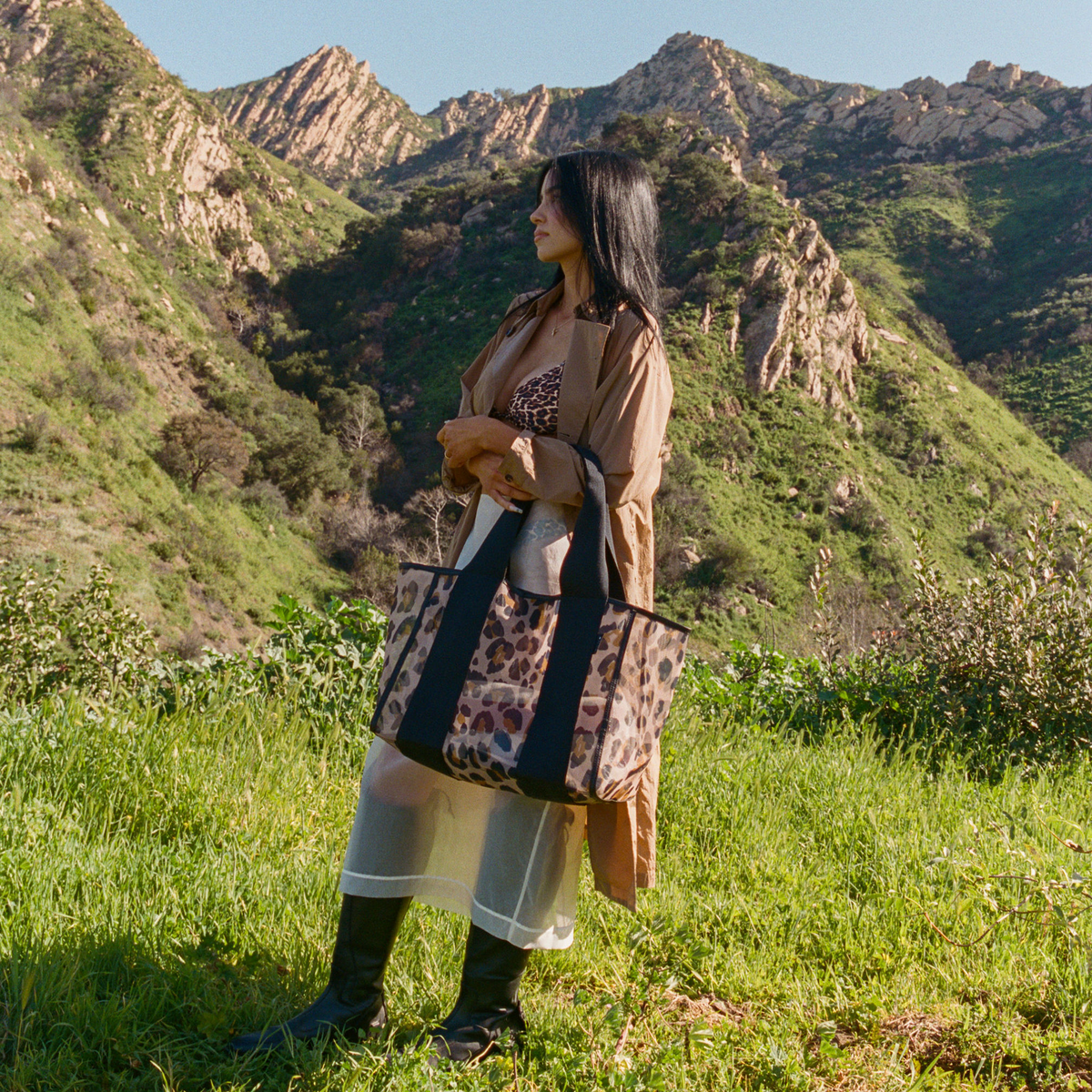 Woman wearing STATE Bags Wellington Cabana Tote Leopard