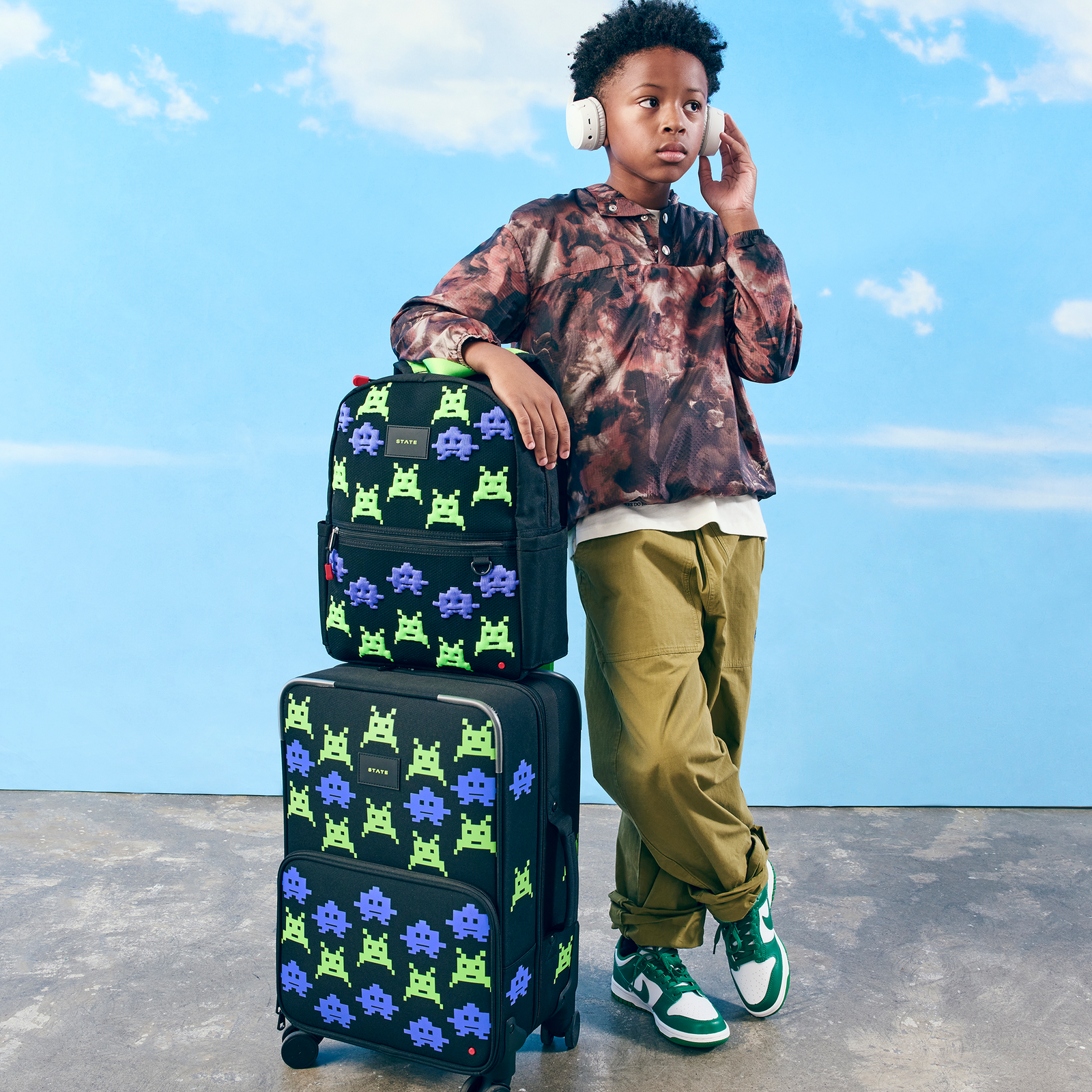 Boy with STATE Bags Kane backpack arcade and logan carry-on suitcase arcade