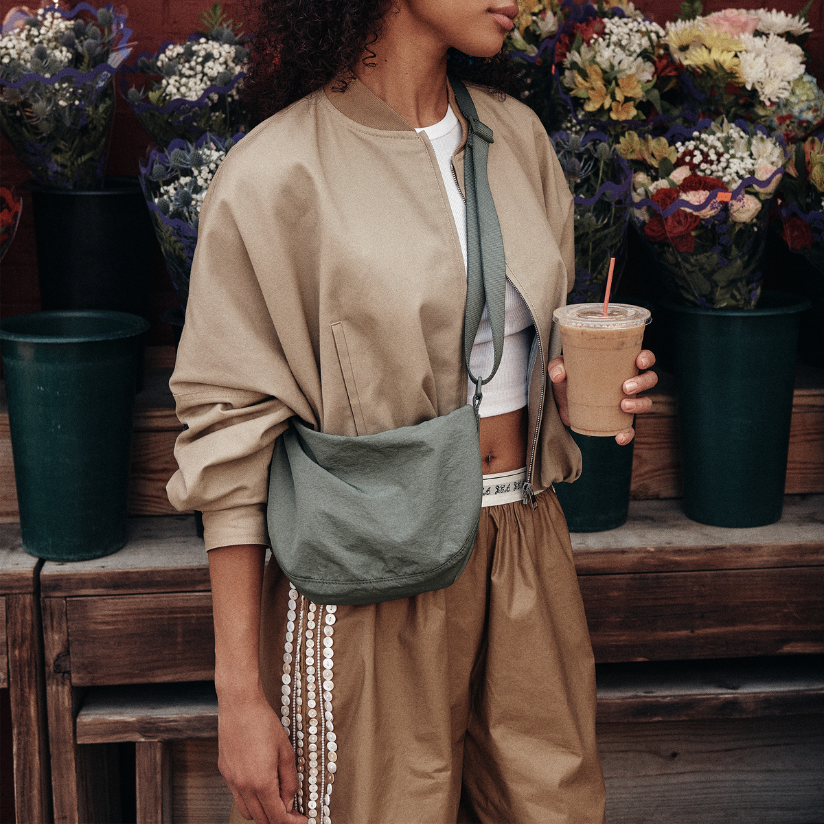 Woman wearing STATE Bags Luna Mini Crossbody Olive
