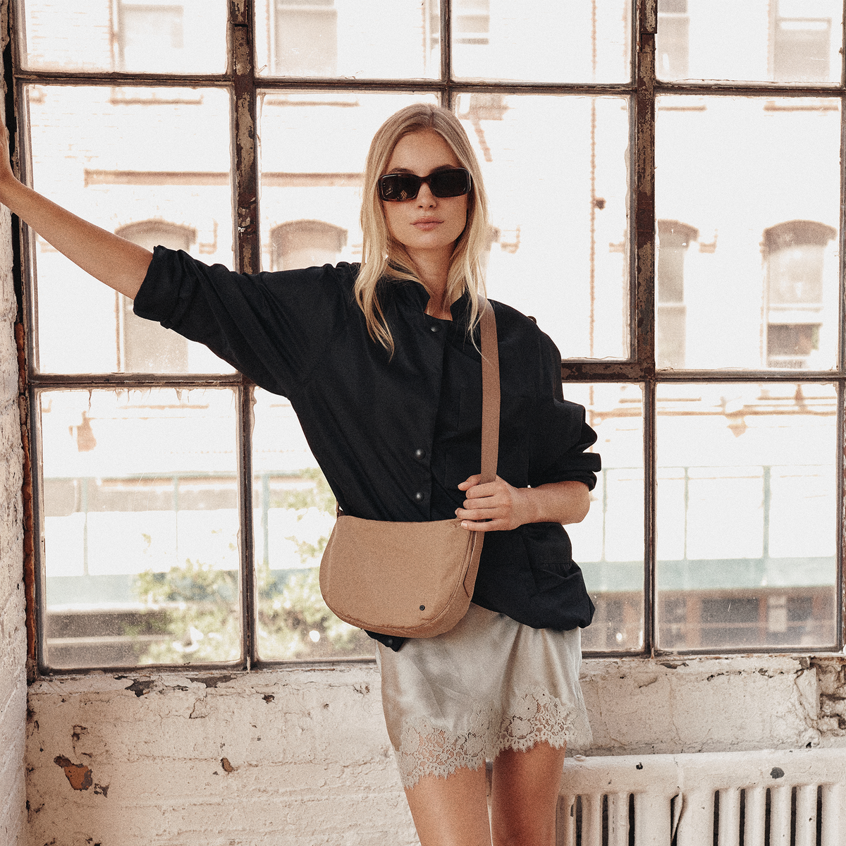 Woman wearing STATE bags Luna Mini Crossbody Fanny Pack Affogato