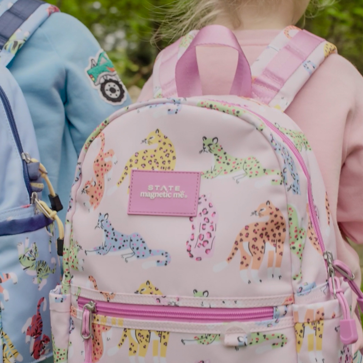 girl wearing STATE x MagneticMe Kane Mini Backpack leopards