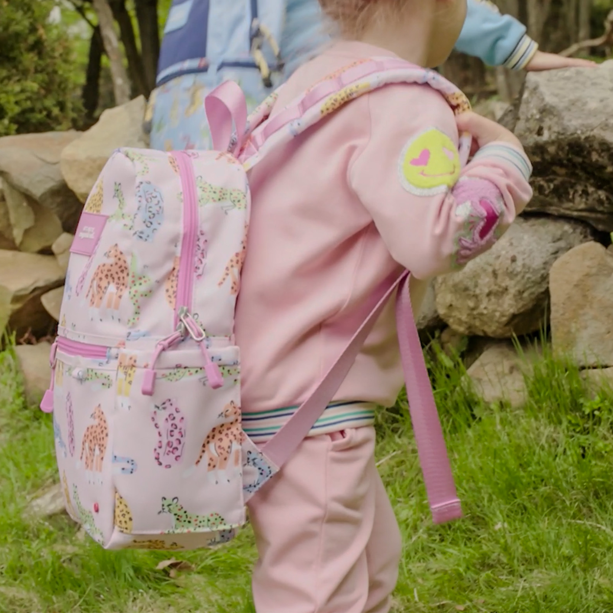 girl wearing STATE x MagneticMe Kane Mini Backpack leopards