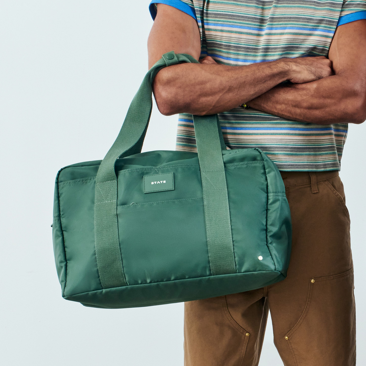 man holding state bags wellington weekender medium olive