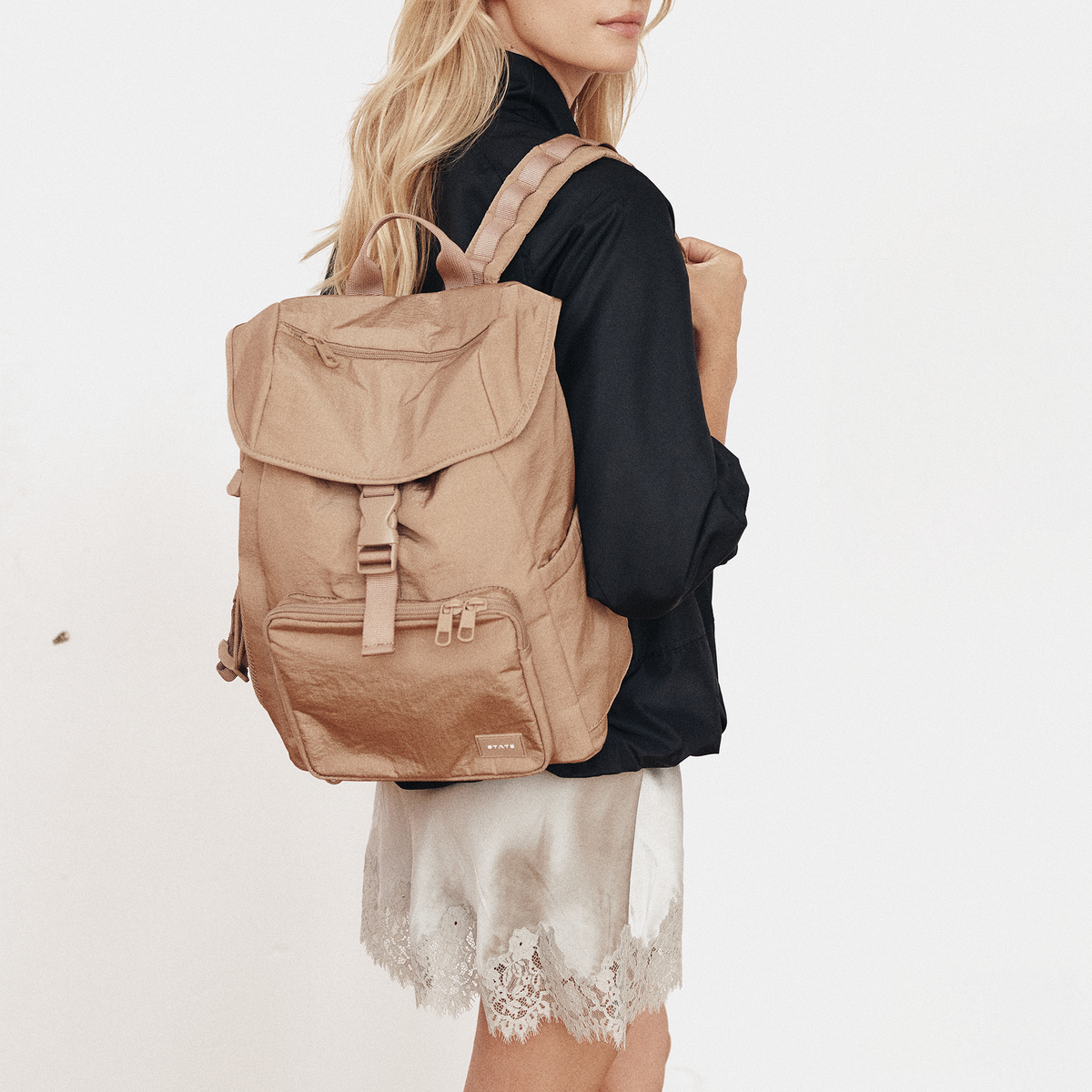 woman wearing STATE Bags Nevie Backpack Affogato 
