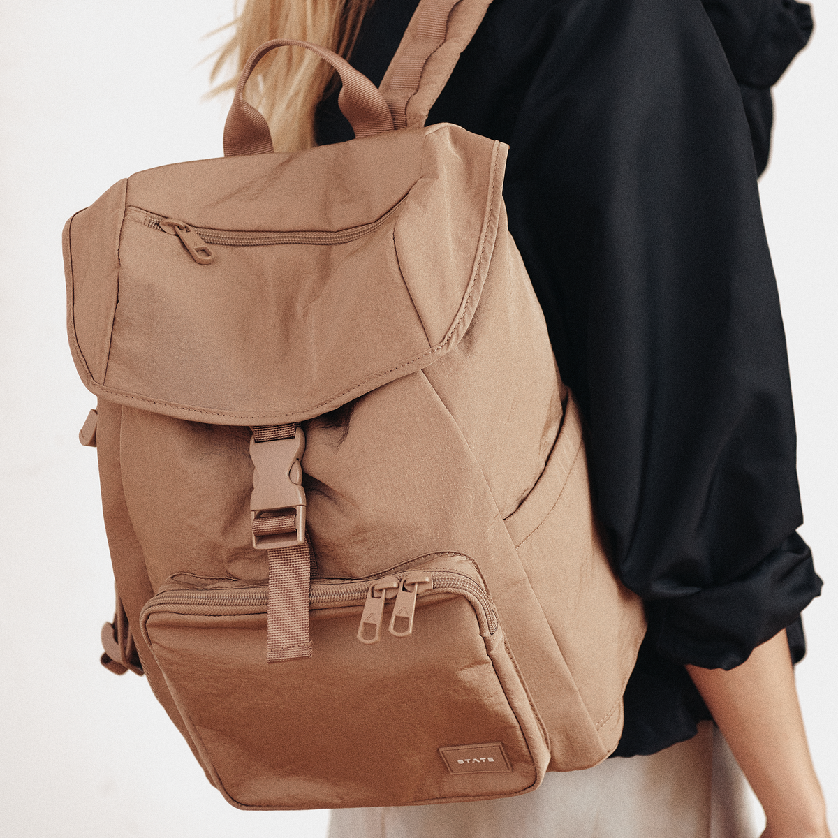 woman wearing STATE Bags Nevie Backpack Affogato 