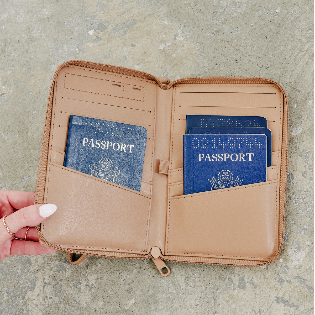 woman holding STATE Bags Passport Holder