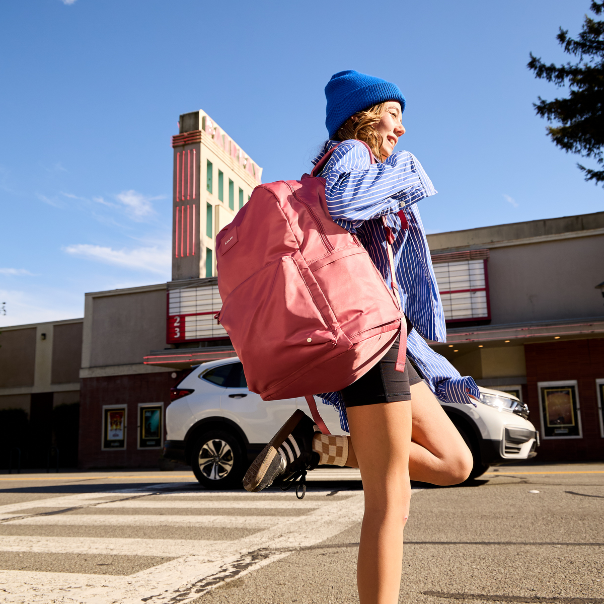 Girl Wearing Rose Backpack
