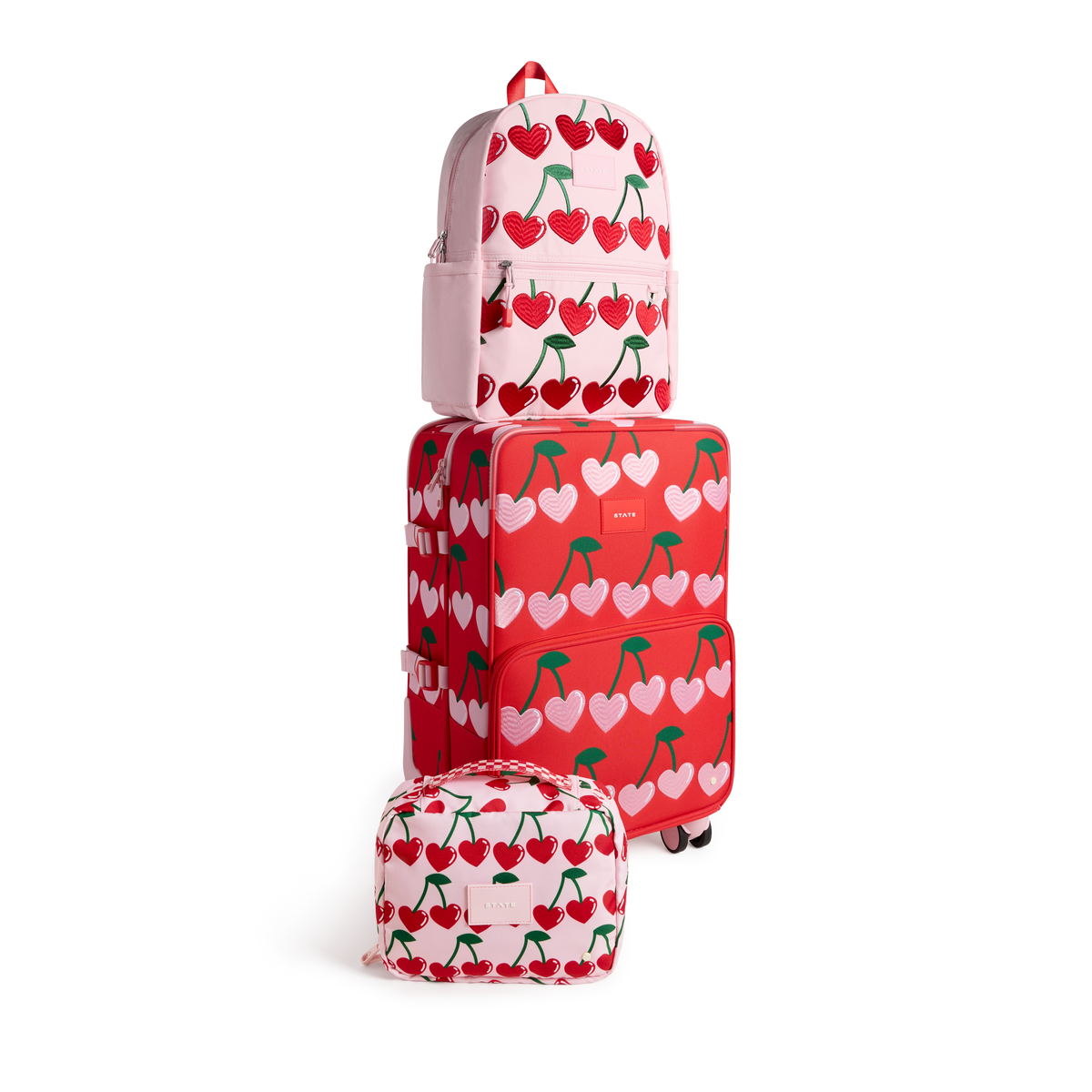 STATE Bags Logan Carry-On Suitcase Cherry with Kane Backpack Cherry and Bensen Toiletry Kit Cherry Front View Click to Zoom