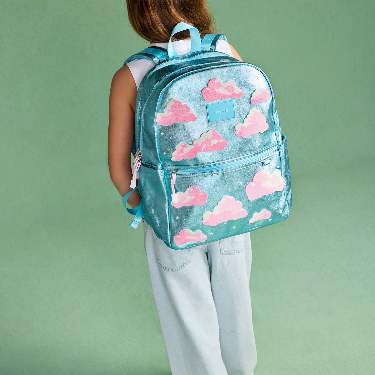 Girl wearing STATE Bags Kane Backpack Clouds 