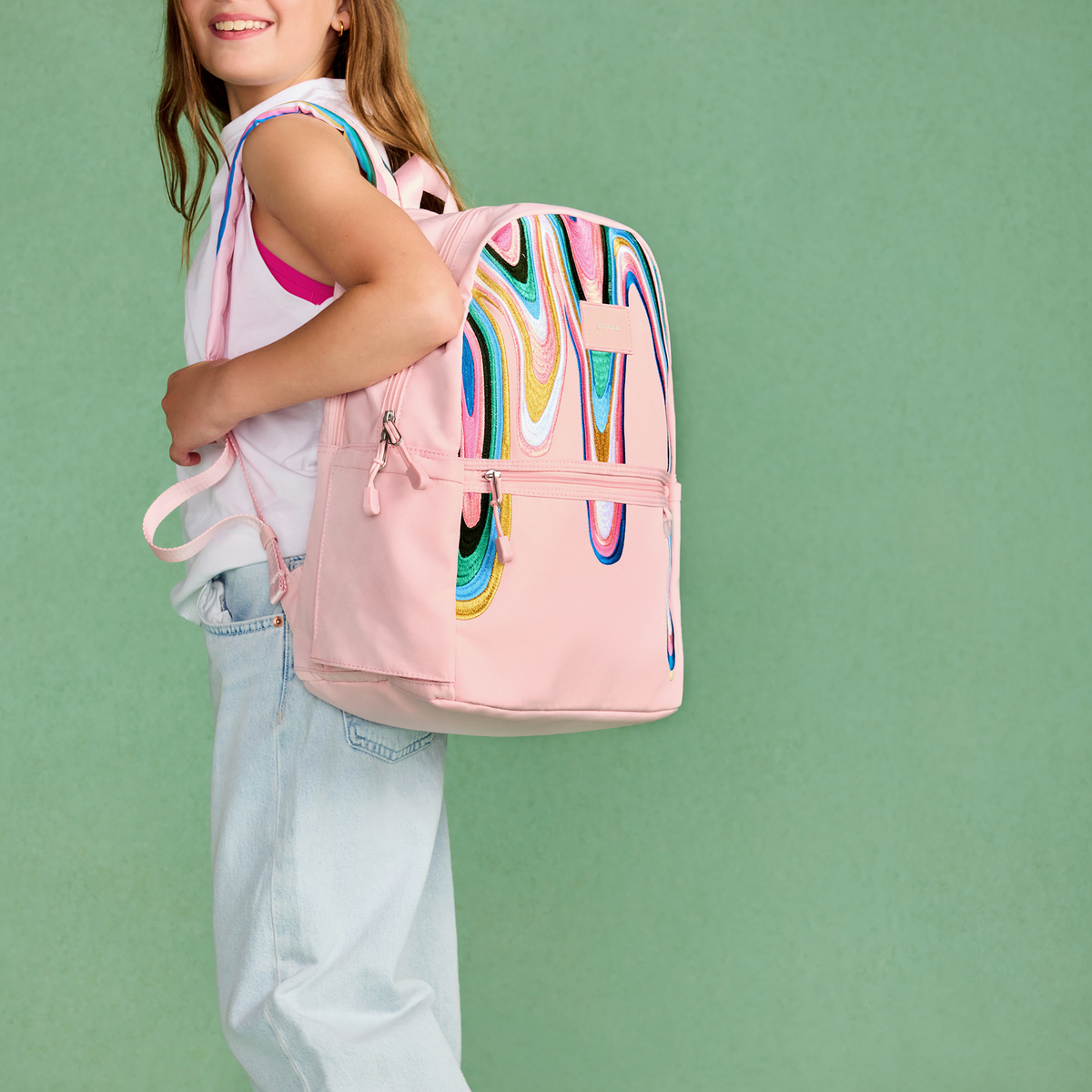 girl wearing STATE Bags Kane Double Pocket Backpack Paint Wave