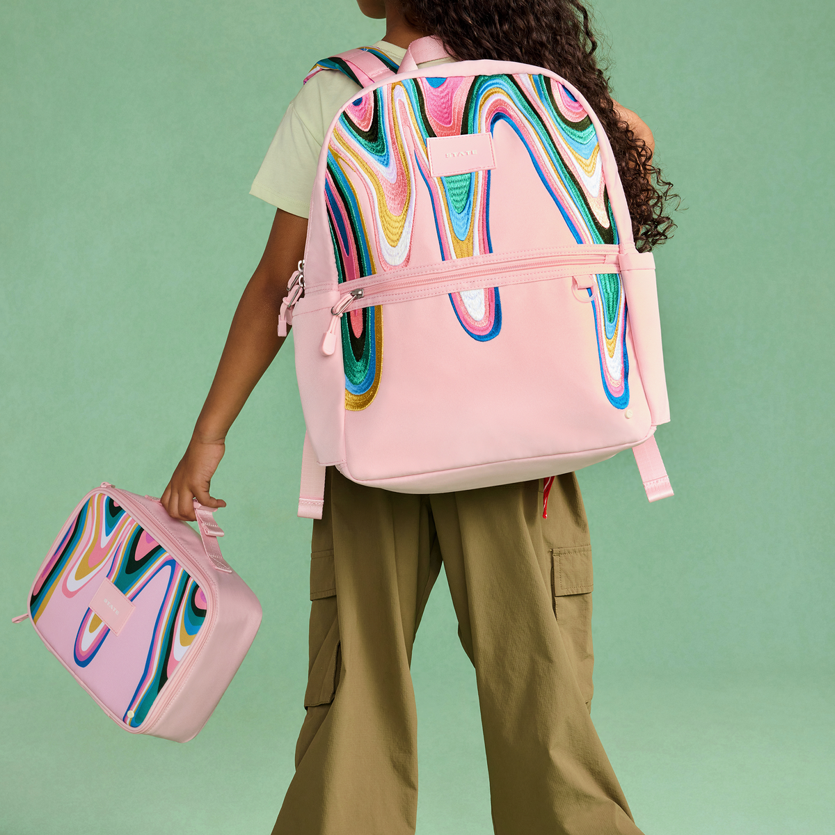 girl wearing Kane Backpack Paint Wave 