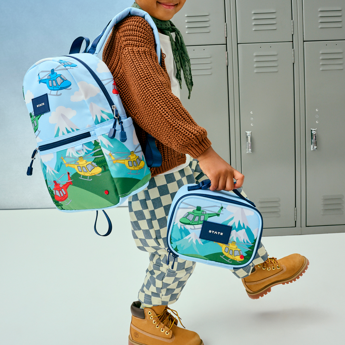 boy wearing both kane mini and mini rodgers helicopters