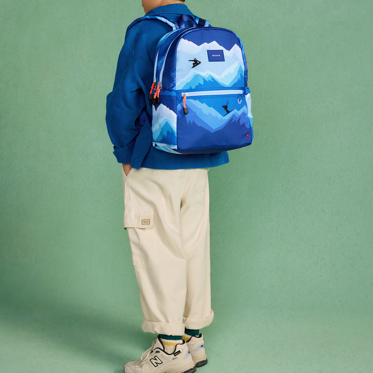 boy wearing STATE Bags Kane Double Pocket Backpack Mountain