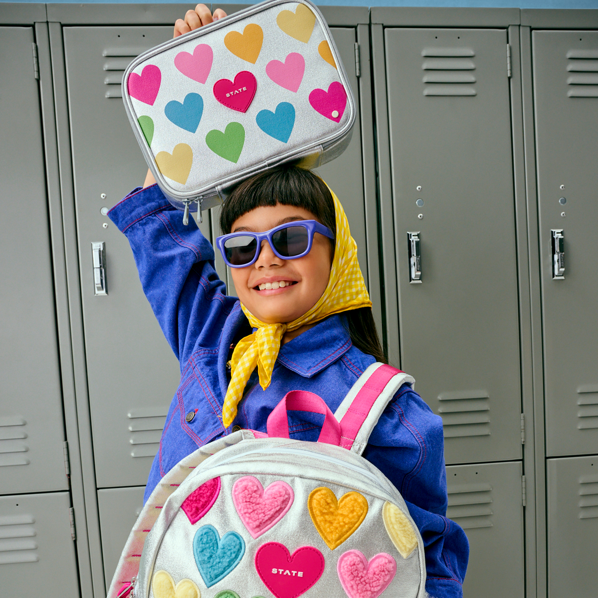 girl holding rodgers lunch box happy fuzzy hearts
