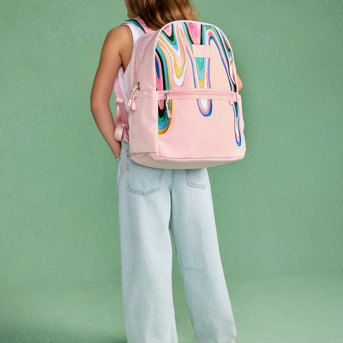 girl wearing STATE Bags Kane Double Pocket Backpack Paint Wave