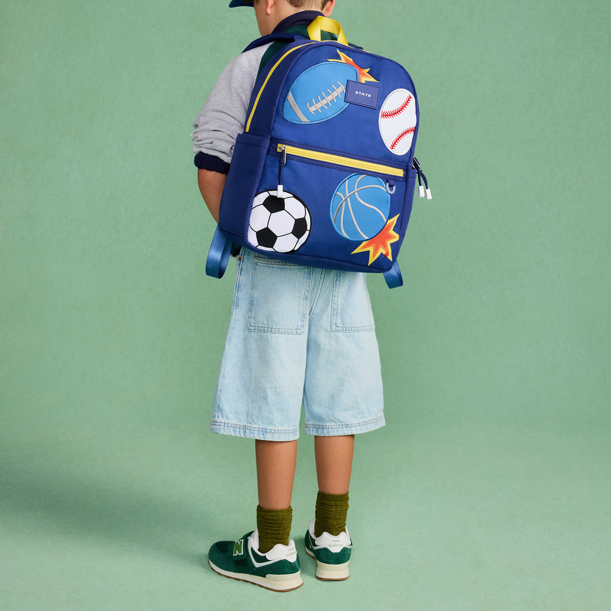 boy wearing STATE Bags Kane Backpack Patchwork sports